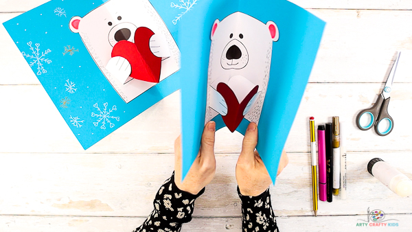 Image showing hands slowly folding the polar bear card.