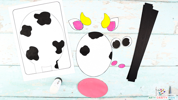 Image showing the cow elements from the printable template colored and cut out.