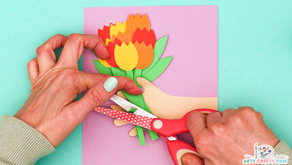 Image showing hands trimming the stems of the tulips.