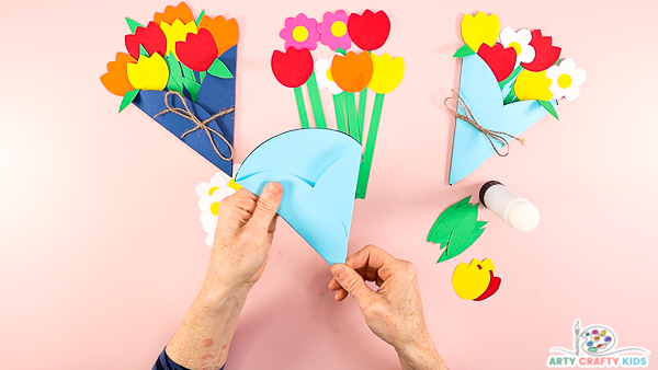 Image showing a folded circle looking like an ice cream cone. This will become the base of flower bouquet.