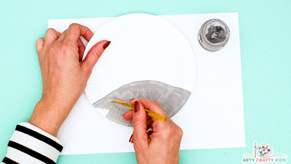 Image showing hands painting a semi-circle grey.