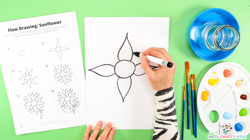 Image showing step two of the how to draw with four petals drawn around the center circle.