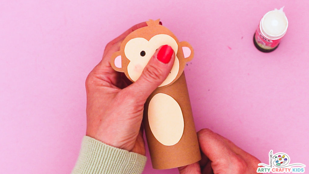 Step 5: Affix the Monkey's Head to the Paper Roll