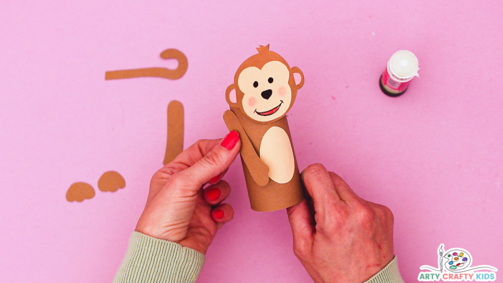 Step 6: Affix the Monkey's Arms to the Paper Roll