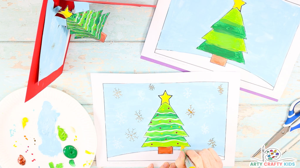 Step 2: Use Acrylic Pens or Markers to Decorate the Christmas Tree and Draw Snowflakes