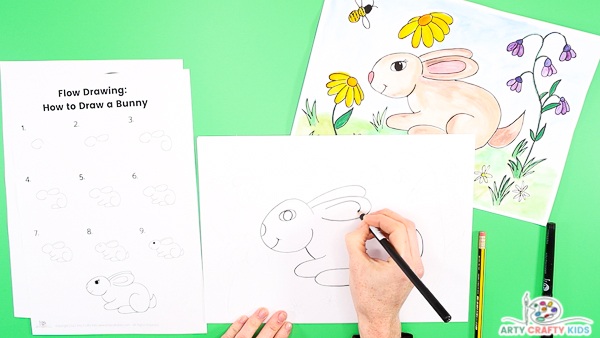 To draw a cute bunny, add an eye with lashes, a little smile and whiskers.
