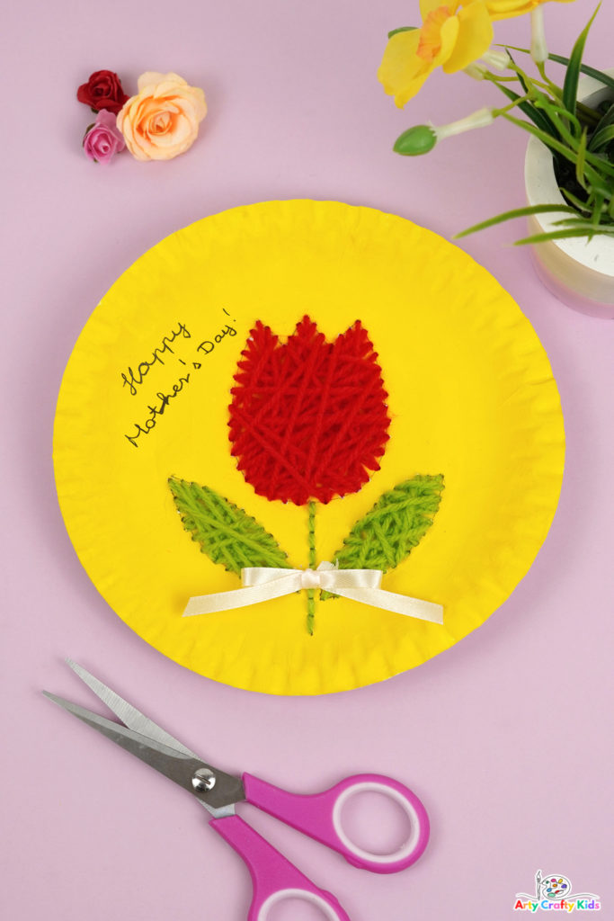 A lovely Spring craft for Mother's Day! This paper plate tulip sewing craft is fun and easy for kids of all ages to make.