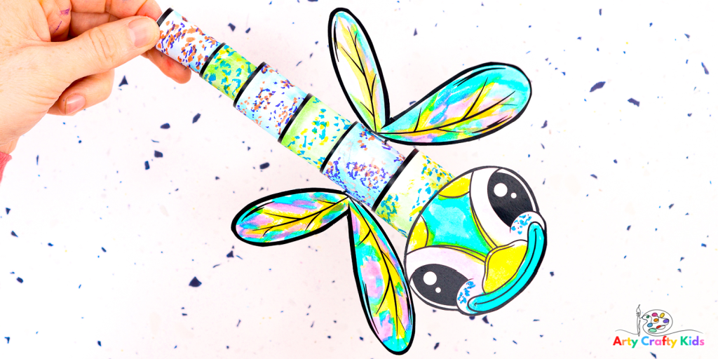Looking for a fun and engaging bug craft? Play with shapes to make a stunning 3D Paper dragonfly Craft with the kids. A fun and easy craft for kids! 