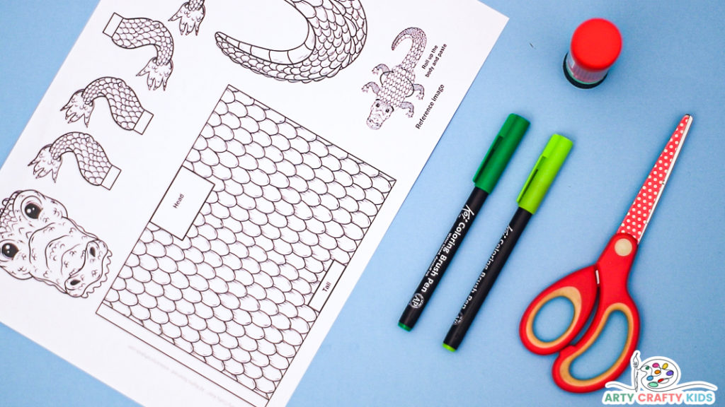 Image featuring the printable Crocodile craft template with a pair of green pens and scissors.