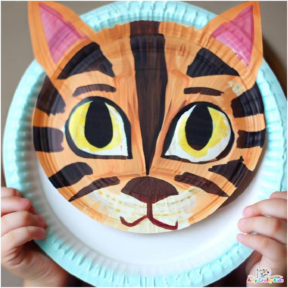 A completed paper plate cat painted as a tiger.