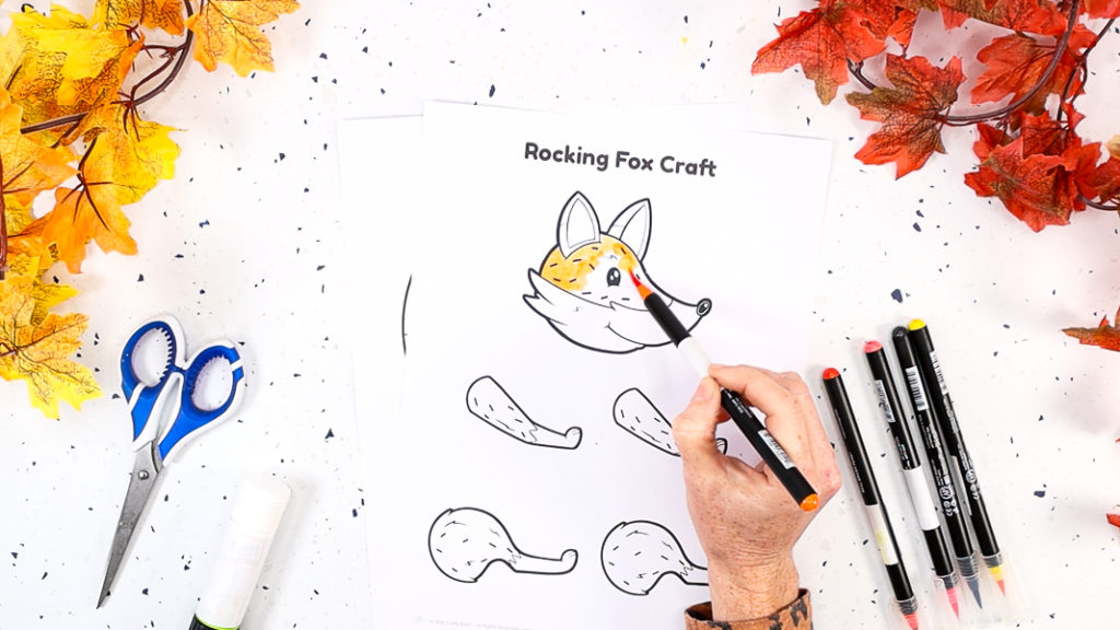 Image featuring a hand coloring in the fox's head.