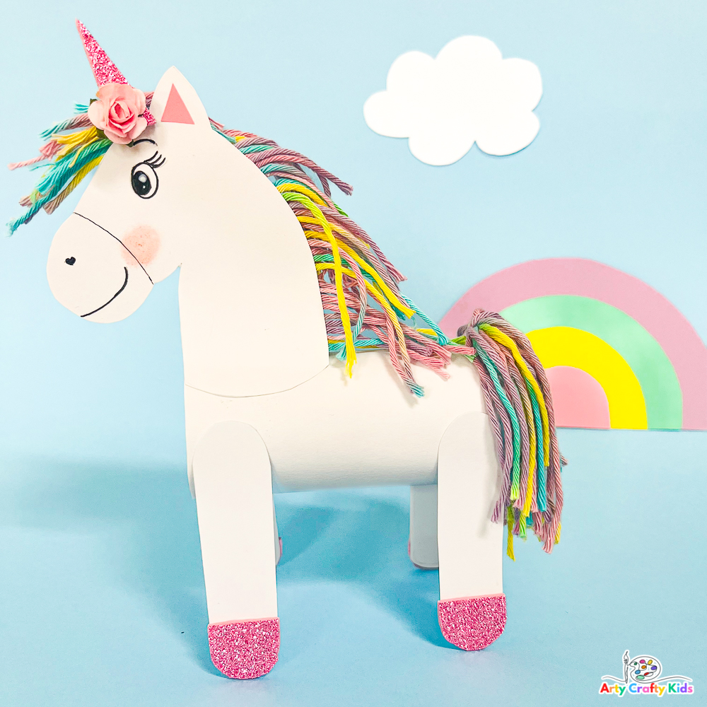 Completed Paper roll unicorn craft with a rainbow tail and mane.