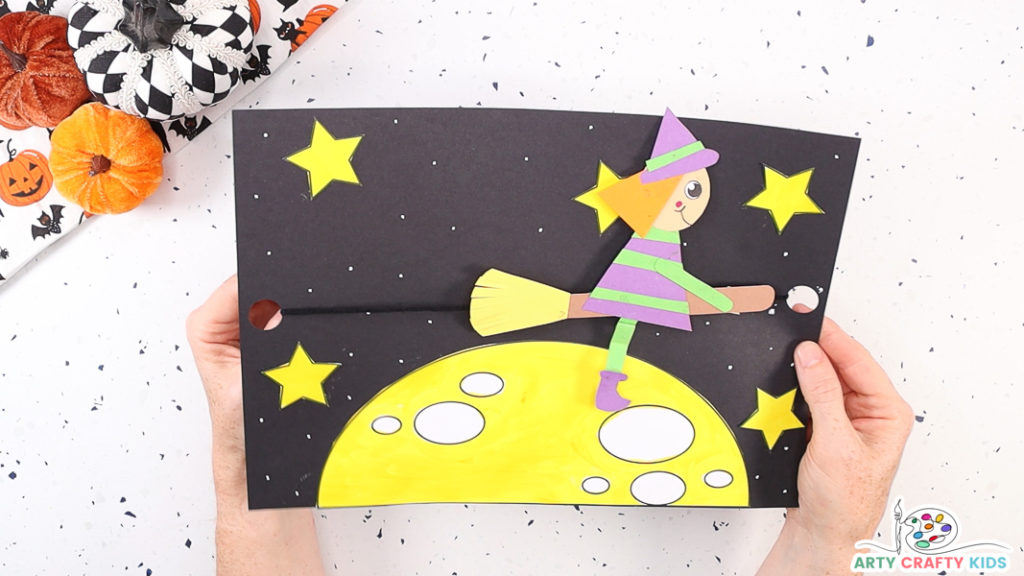 Image featuring a completed paper flying witch craft idea for Halloween.