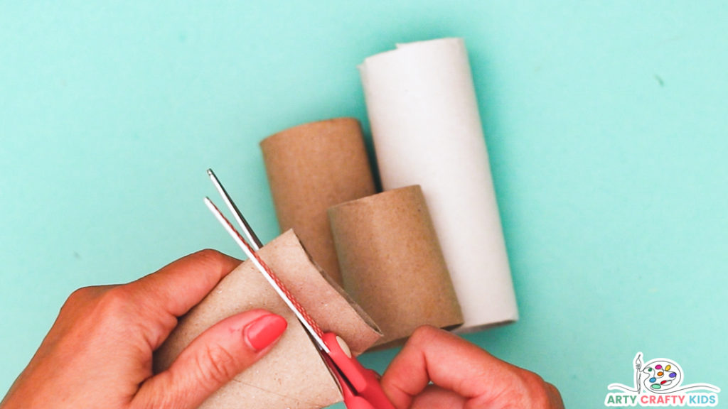 Image featuring a hand cutting the paper rolls into four different sizes.