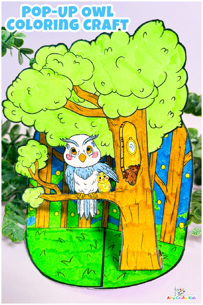 Completed woodland inspired Pop-Up Owl Coloring Craft, resting amongst a collection of greenery.