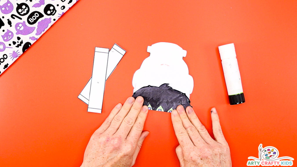 Image Step 3: Folding along the hair lines of the Frankenstein template.