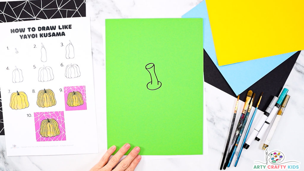 A pumpkin stem draw onto bright green card stock.