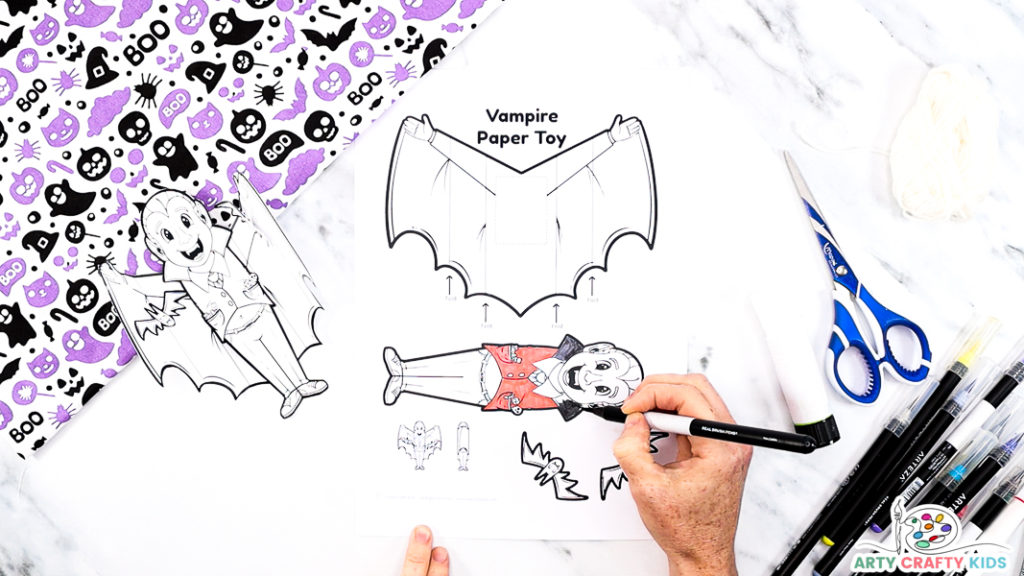 Step 1: Coloring in the printable vampire template.