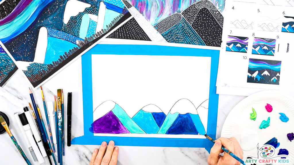 Image featuring Step 5: A hand painting the mountains green, purple, light and dark blue.
