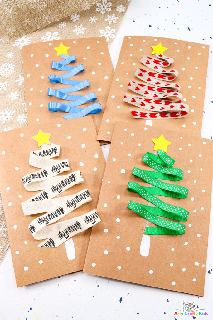 Image showing a collection of completed Ribbon Christmas Tree cards. The homemade Christmas cards present ribbon trees into different colors, all surrounded by snow and completed with a star.