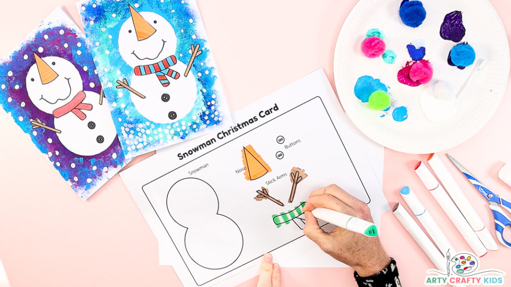 Image of a hand coloring in the snowman elements.