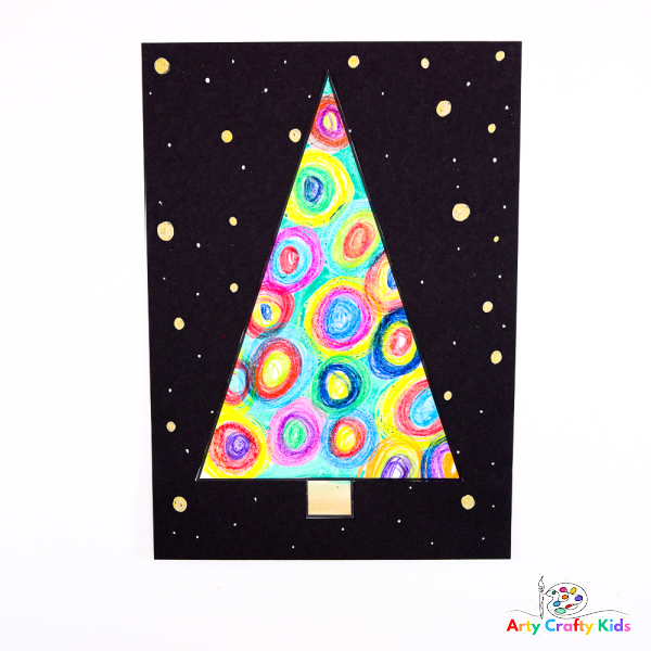 Image of a Christmas tree completed with circles drawn with crayon - preschool idea.