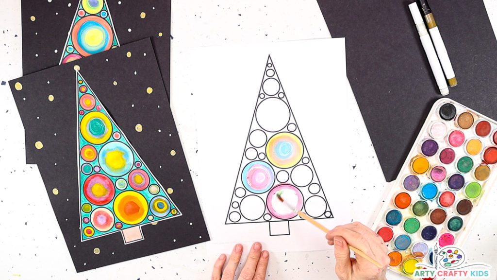Hand painting circles within the Christmas tree template.