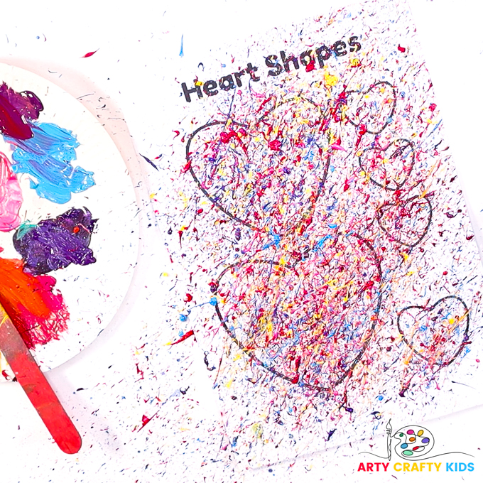 Image showing hearts splatted in paint, so much so, the lines of the hearts are obscured by paint splats.