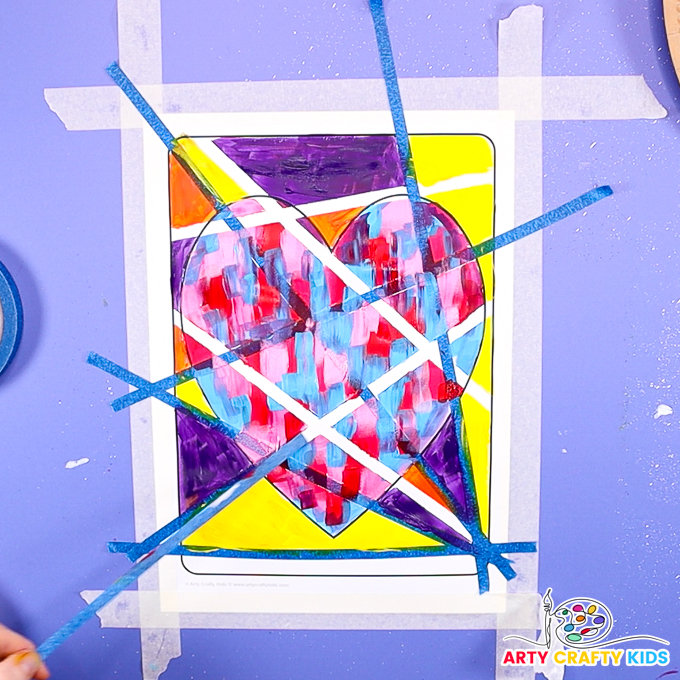 Image of a hand peeling the tape away to reveal the tape resist affect.