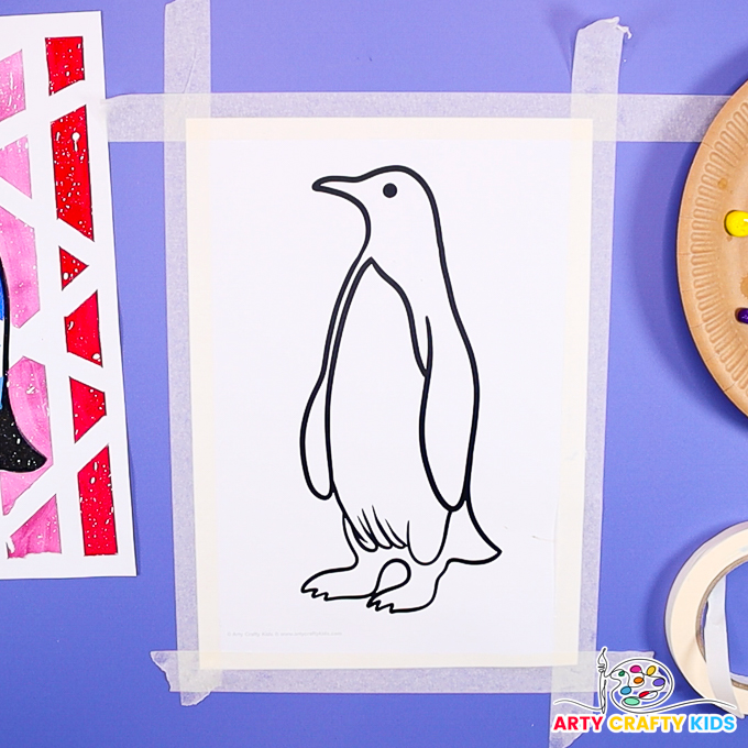 Image of a penguin template with a border of tape.