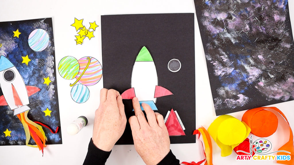 Image of hand assembling the spaceship.