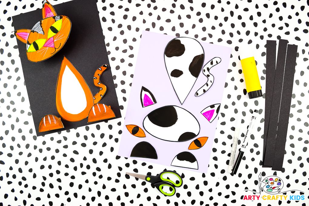 Image showcasing the cat elements cut out from the template, surrounded by craft supplies and a completed cat craft.