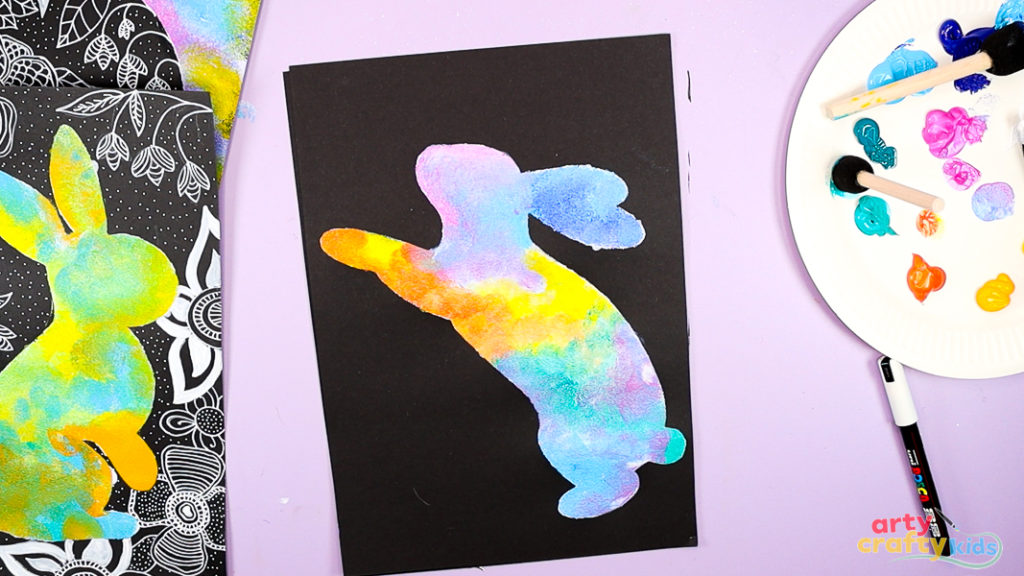 A complete and colorful bunny silhouette painting.