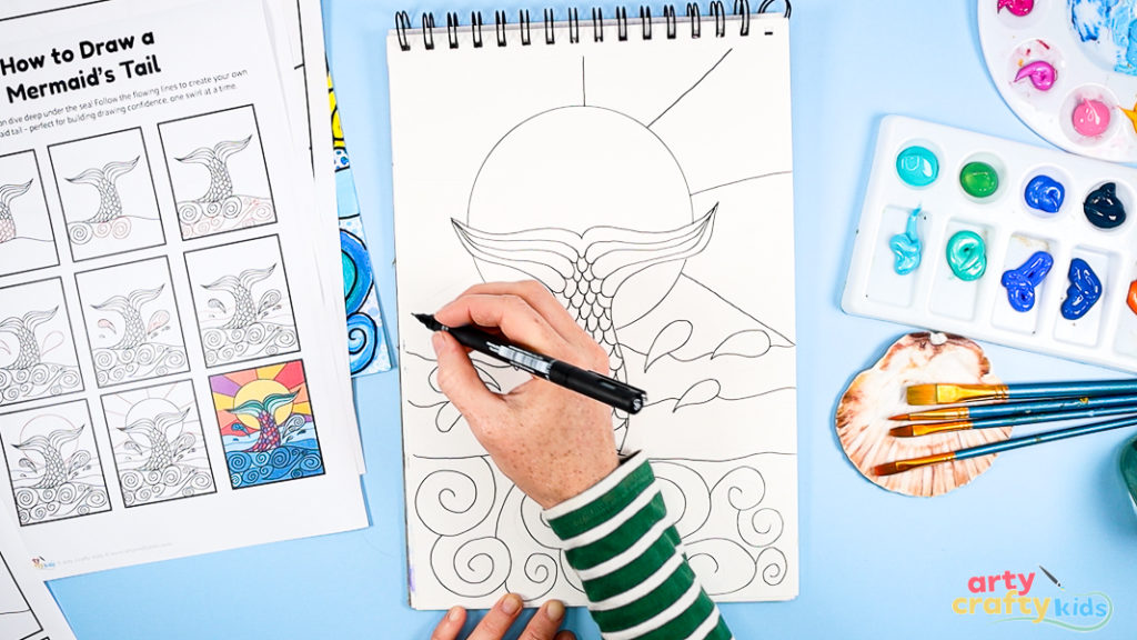 Image of Step 5: Drawing a large sun behind the mermaid tail using a circular shape and dividing the background into sections for pattern and color.