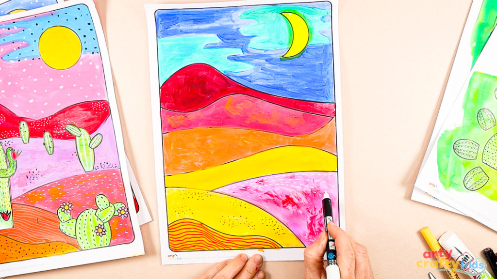 Image featuring a hand drawing a series of white dashed lines within the pink hill segment of the desert landscape art.