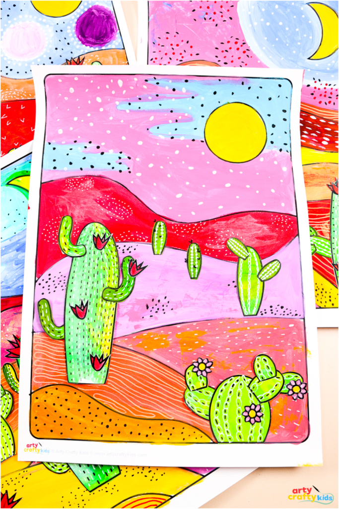 Mixed-media cactus desert landscape art project for kids featuring painted hills and hand-drawn doodle patterns.