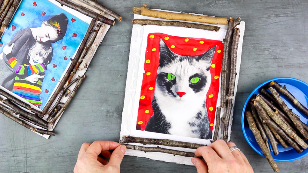 Image showing sticks being placed around the cat to create a photo frame.