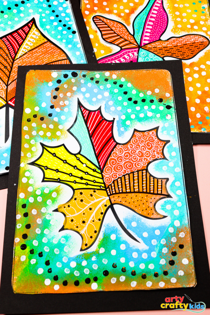 Autumn leaf painting for kids with bold patterns, contrasting colors, and a dotted outline effect.