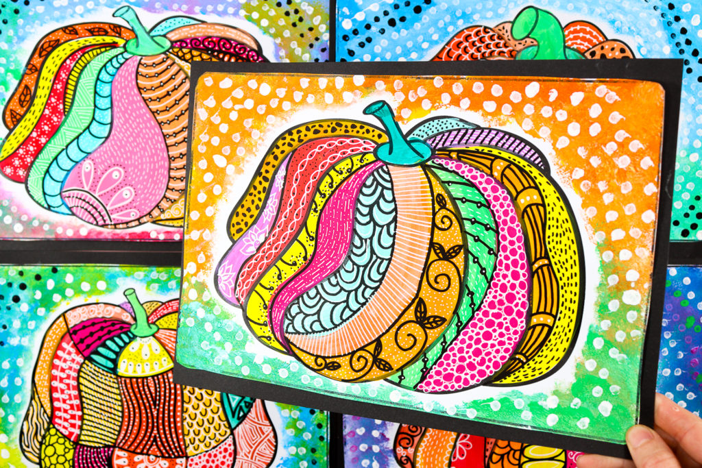 Completed pumpkin pattern art featuring orange, pink, yellow, and teal sections filled with doodles and designs, surrounded by a dotted background.