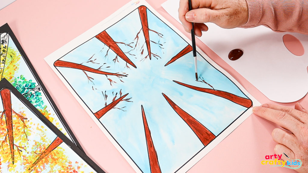 Painting short, wiggly brown lines to depict tree branches.
