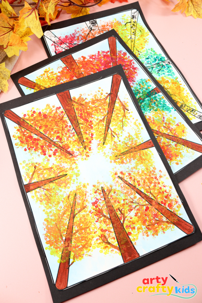 Autumn art lesson for kids using cotton buds to dab leaves in warm colors, exploring perspective and texture.